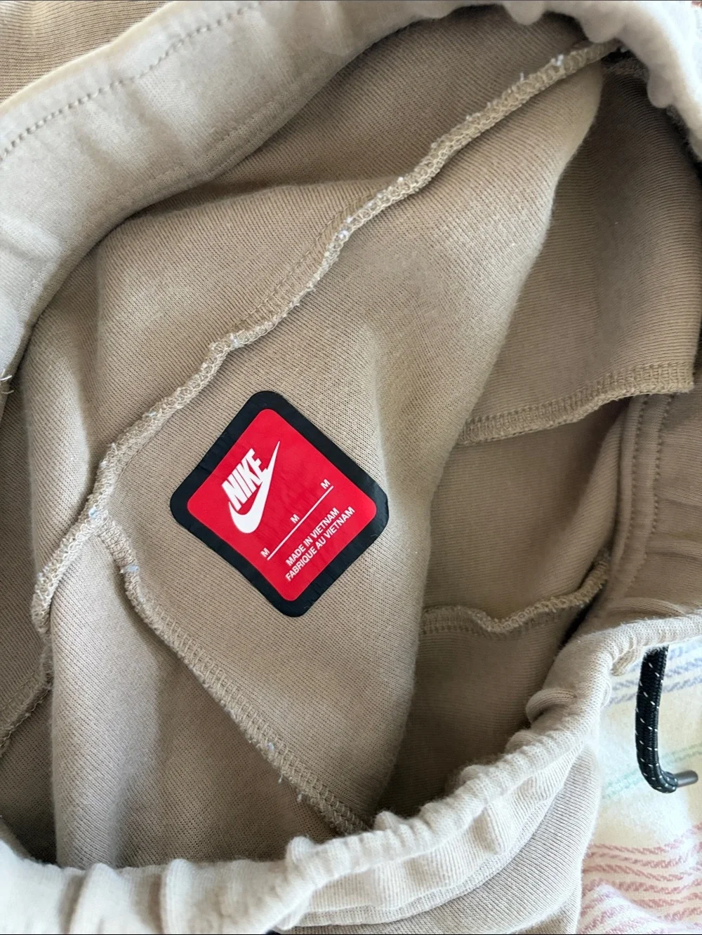 Nike Beige Pants with Light Blue Jeans and Brown Joggers